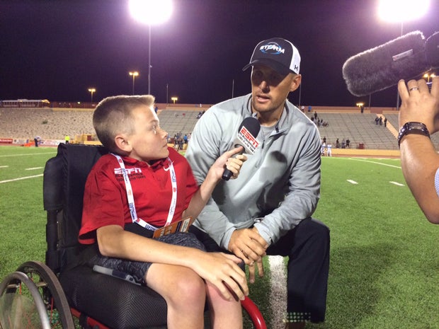 Austin Denton interviews Cleveland High coach Heath Ridenour after a game.