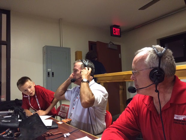 Austin Denton supports his colleagues in the press box, "The Coach" David Williams (color) and Scott Galetti (play by play).