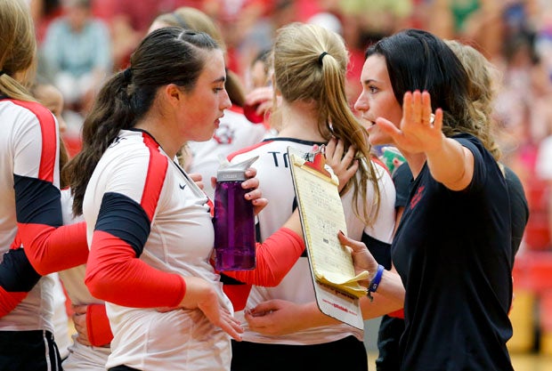 Coach Dana Daprile talks strategy with Taylor Hammill during a timeout.