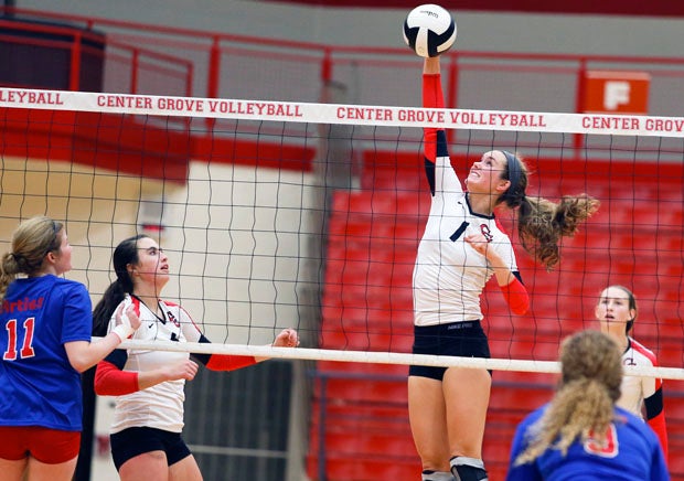 Center Grove senior Ali Line spikes the ball while teammates Taylor Hammill (left) and Madison Smeathers (right) look on. Center Grove is the MaxPreps Indiana Team of the Week, presented by the Indiana Army National Guard.