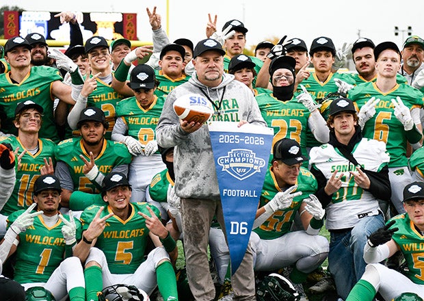 Sonora head coach Kirk Clifton celebrates with his team following its section championship victory over Ripon Christian. (PHOTO: Sam Stringer)