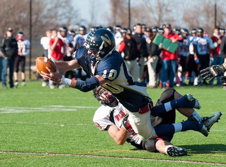 Needham's Mike Panepinto stretches out for one of his five touchdowns in 39-21 victory on Thursday.