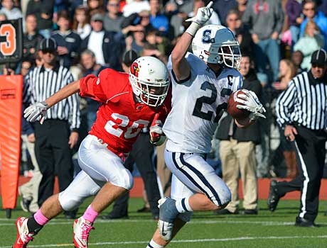 Joey Zelkowitz puts the finishing touches on Staples' 48-30 win with 22-yard touchdown run in the fourth quarter.
