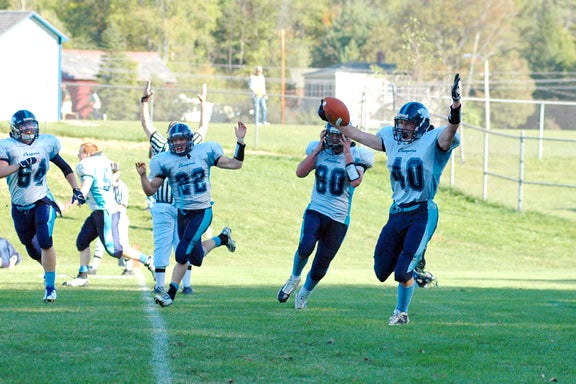 Mt. Mansfield players celebrate their last-second win over Otter Valley on Saturday.