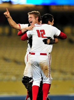 Alex Horowitz (12) and Arden Pabstcelebrate their team's title.