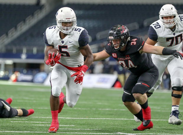 Brock Sturges with one of his three touchdown runs.