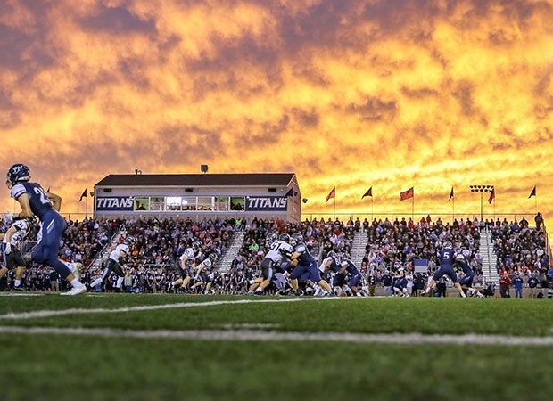 A fiery Missouri sky is the backdrop for the battle between host Lee's Summit West and Staley.