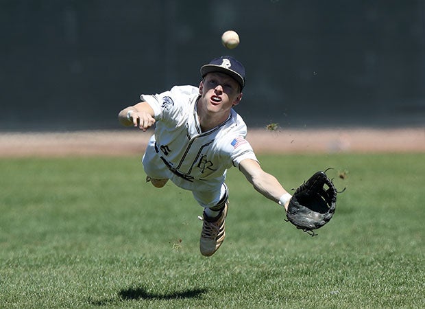 Pusch Ridge Christian Academy (Ariz.) center fielder Matt Weber dives in an attempt to make a catch during a game in the Lancer Classic.