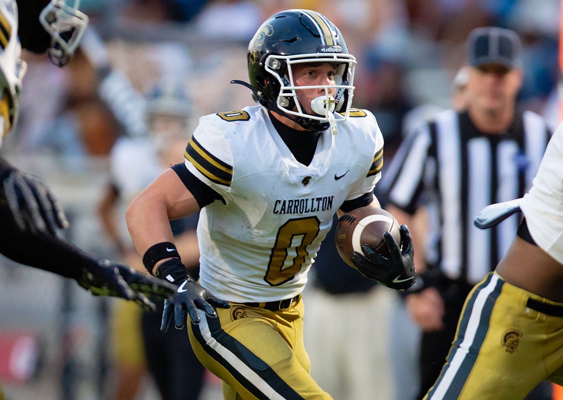 Senior Cameron Wood of Carrollton has 1,473 rushing yards and 33 touchdowns for the 14-0 Trojans. Tonight No. 1 Carrollton takes on No. 5 Buford for the Georgia Class AAAAAA championship and the national title. (PHOTO: Corey Jones)