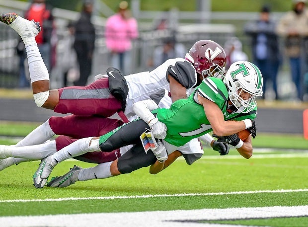 Tatum's Carson Gonzalez carries two Jefferson defenders into the end zone. (Photo: Wayne Grubb)