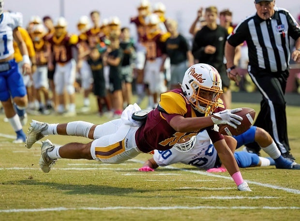 Collinsville's Nathen Bocanegra dives for the end zone against Celeste on Oct. 7. (Photo: Freddie Beckwith)