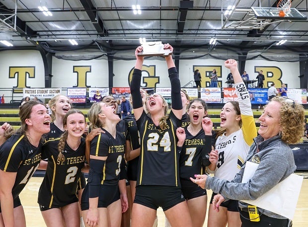 St. Teresa Academy's Reagan Fox hoists the Missouri District Championship trophy after a win over Lee's Summit West. (Photo: David Smith)