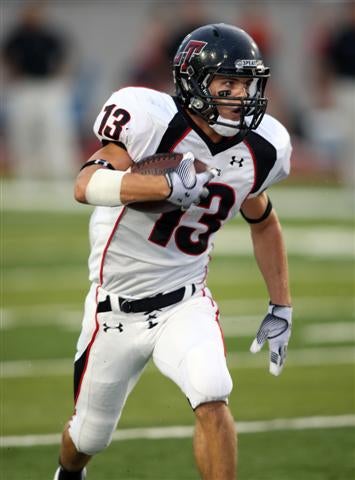 Rice-bound Andy Erickson (13) makes Brewer's job easier. 