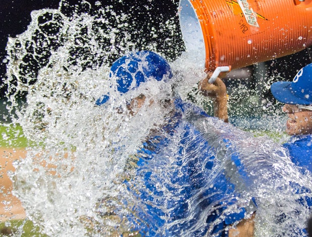 Braintree (Mass.) pitcher Zack Delvecchia gives head coach Bill O'Connell a Gatorade dousing following his team's 7-2 victory in the MIAA Division 1A championship game in June.