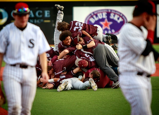 Littlefield (Texas) players celebrate in a dog pile after a walk-off win against Shallowater in the UIL 3A Regional title game in June.