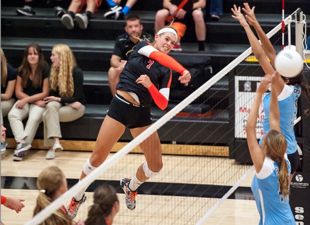 MaxPreps 2014 National Volleyball Player of the Year Alexa Smith of Lewis-Palmer (Colo.) spikes the ball past two defenders during a match against Pueblo West last August.
