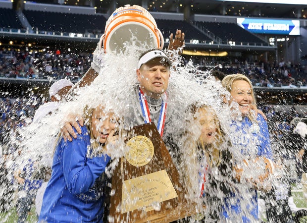 Navasota (Texas) head coach Lee Fedora and his family receive a Gatorade soaking following his team's victory over Argyle in the UIL 4A Division 1 state championship at AT&T Stadium in December.