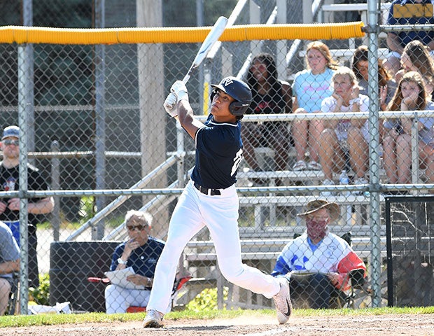 A Pleasant Valley player watches his hit.