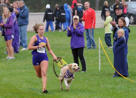 Sami Stoner with her seeing-eye dog Chloe are fan favorites wherever they run.