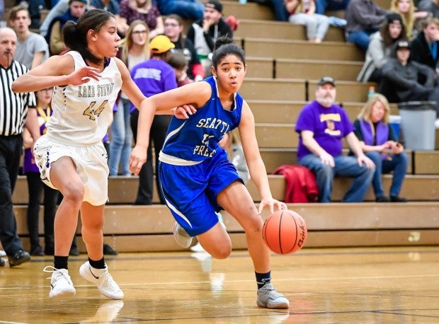 Tamia Johnson drives the ball to the basket during her freshman year.