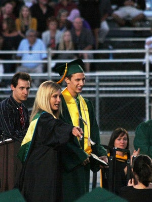 Zach Pickett poses with Ponderosa principal 
Lisa Garrett on Friday's graduation ceremony.