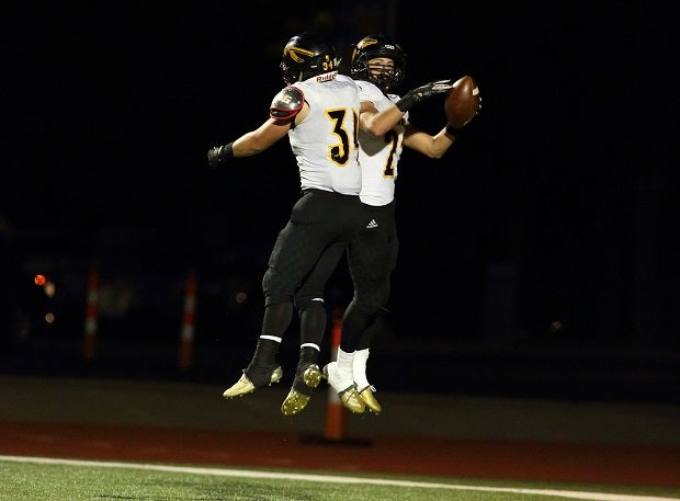 Jake Cocking celebrates a touchdown with an Andale teammate in an October win over Collegiate.