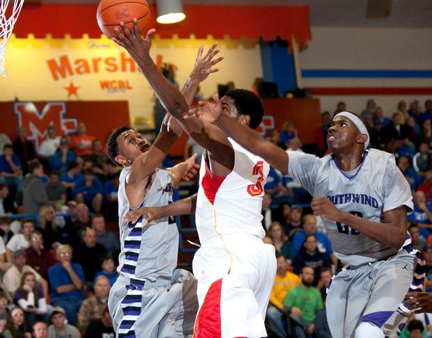 Johnathan Williams III (left) and JaJuan Johnson (far right) were unable to help No. 9 Southwind stop Oak Hill Academy's win streak at the Marshall County Hoopfest.