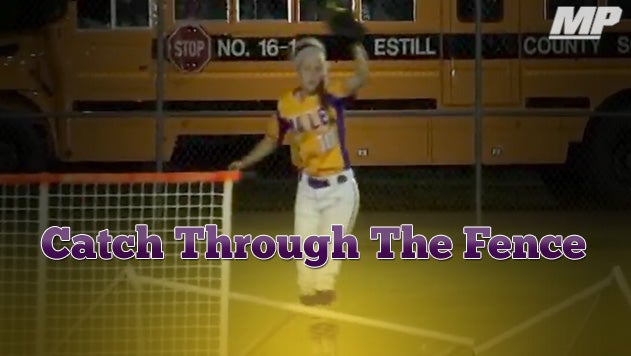 Video: Softball catch through OF fence