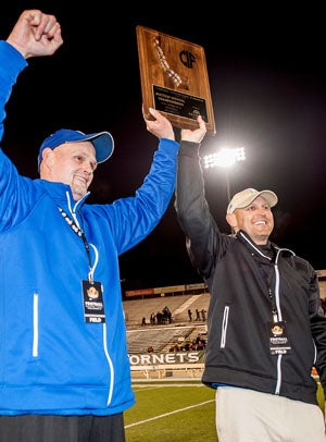 Folsom coaches Kris Richardson (left) and
Troy Taylor celebrate. 