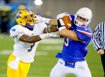 Folsom's Josiah Deguara out-wrestles Tieneal
Martin for the ball.