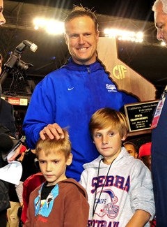 Coach Scott Altenberg earned his secondBowl Game title trophy at Serra.