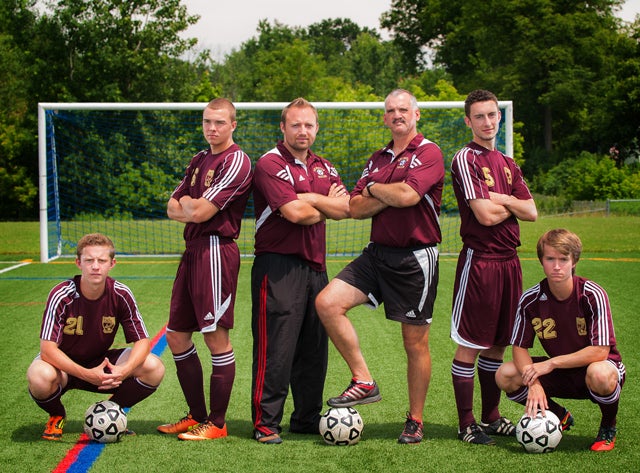Arlington has two things in its favor this season: A Class AA state title in hand and a boatload of winning tradition. Upholding that tradition this year will be (from left to right) Pat Mogan, Kevin Hoff, assistant coach Aidan Topley, head coach Craig Sanborn, David Verdis and Eric Eastman.
