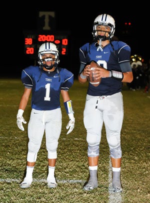 Emanuel Gant and Lorenzo Valencia pose after
Friday's game. Gant passed to Valencia for
an 11-yard touchdown that pushed Gant to
the state record amount.