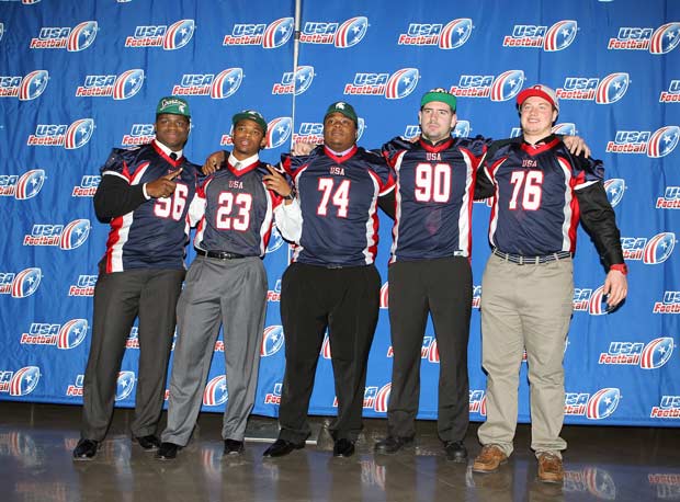 In a picture with other Big Ten signees, Craig Evans (74) stands after a childhood saved by his selfless aunt. Enoch Smith Jr. (56) played a huge role in getting Evans to switch his commitment to the Spartans.