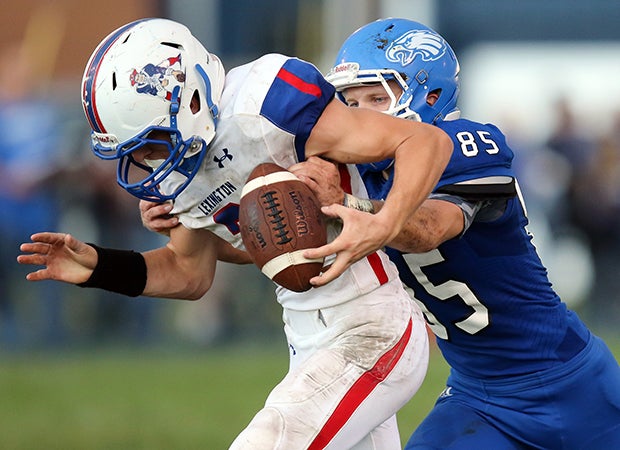 Holden (Mo.) cornerback Zack Jones reaches from behind to cause a Lexington player to fumble.  