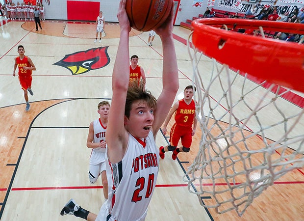 Jaxon Recer of Pottsboro (Texas) soars in for a two-handed dunk against S&S Consolidated.