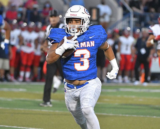 Cam'ron Barfield of Bishop Gorman runs away from the defense during one of his five trips to the end zone Friday night.