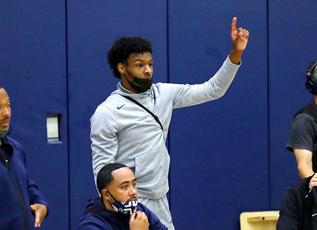 Sierra Canyon's Bronny James motions to his teammates on the court.