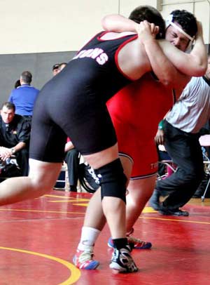 Mountain View heavyweight Alexis Garcia, in red,goes for a hip toss at the Blackford Duals.