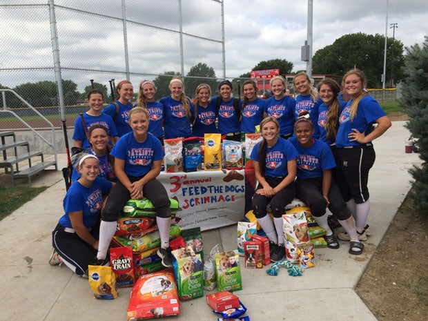 Millard South's softball team also volunteers its time in the community. This photo is from the "Feed the Dogs' preseason scrimmage. They donated over 500 pounds of dog food to the Nebraska Humane Society.