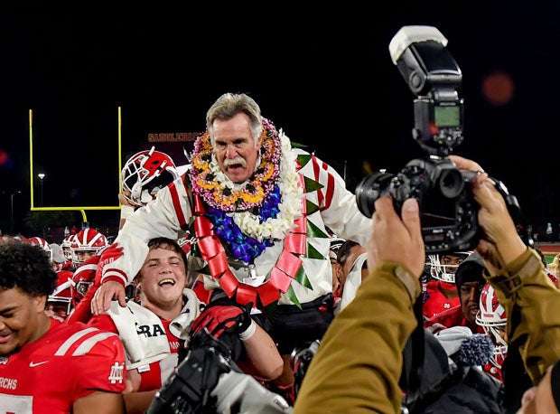 Bruce Rollinson was carried off the field after Mater Dei won a CIF Open Division title over Serra in December. 