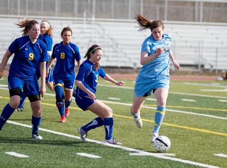 Kelly Cobb's exceptional soccer skills enable her to run away from the competition in many Alaska high school soccer matches.