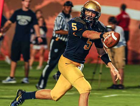 John O'Korn led Aquinas to a season-opening victory against a tough Columbus squad.