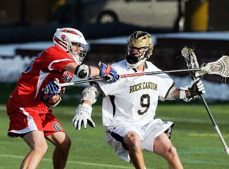 Rock Canyon standout Wilkins Dismuke, right, has earned a national profile in boys lacrosse. He will play next season at Johns Hopkins University.