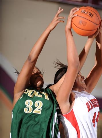 Bolingbrook's Morgan Tuck battles Poly's Ta'nitra Byrd (32).