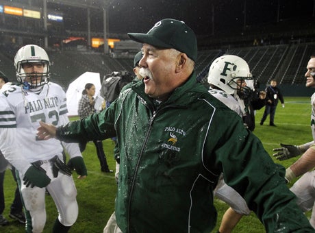 Palo Alto football coach Earl Hansen celebrates shortly after being doused by Gatorade following a State Bowl title win over Centennial (Corona, Calif.) in 2010. Hansen's career started with another joyous moment: Coaching 49ers' coach Jim Harbaugh in his initial season in 1980. 