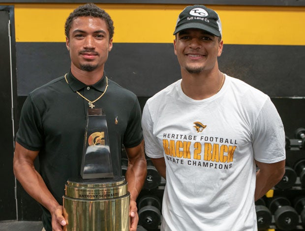 Minkah Fitzpatrick (left) and Anthony Schwartz pose Thursday after the recent American Heritage sprinter and football player won the Gatorade Male Track and Field Athlete of the Year award.