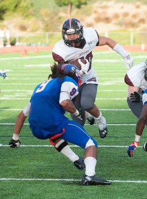 Desert Ridge's Danny Siamau rushes in for atouchdown in the fourth quarter.