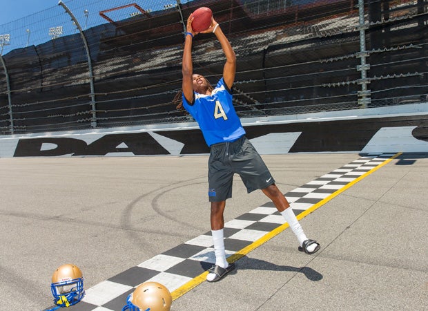 Defensive back Cyrus Fagan poses at the start/finish line.