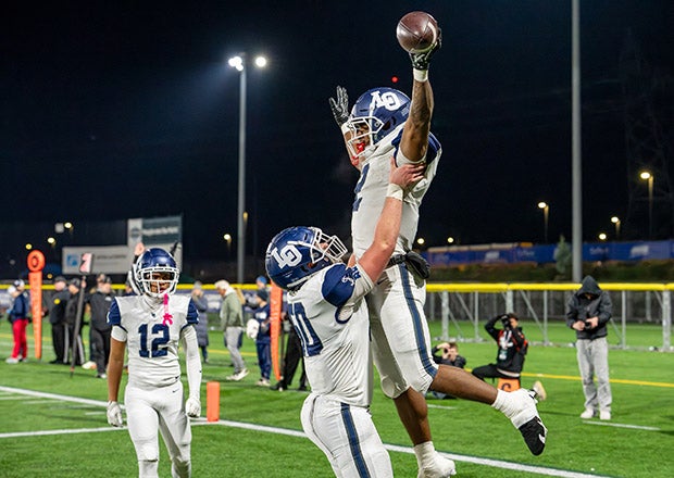 MaxPreps Oregon Player of the Year LaMarcus Bell celebrates one of three touchdowns he scored in a semifinal victory over Nelson. (PHOTO: Troy Tsuma)